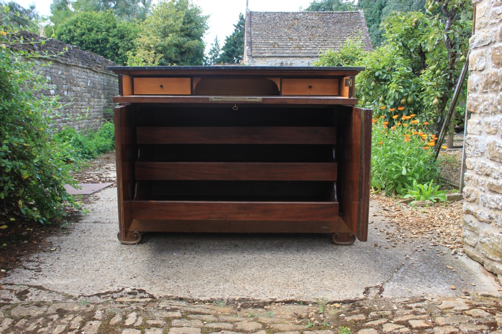 A 19th-century French walnut secretaire featuring a dark marble top, a top drawer, double cupboard doors flanked by spiral twist columns, and scroll feet. View XI