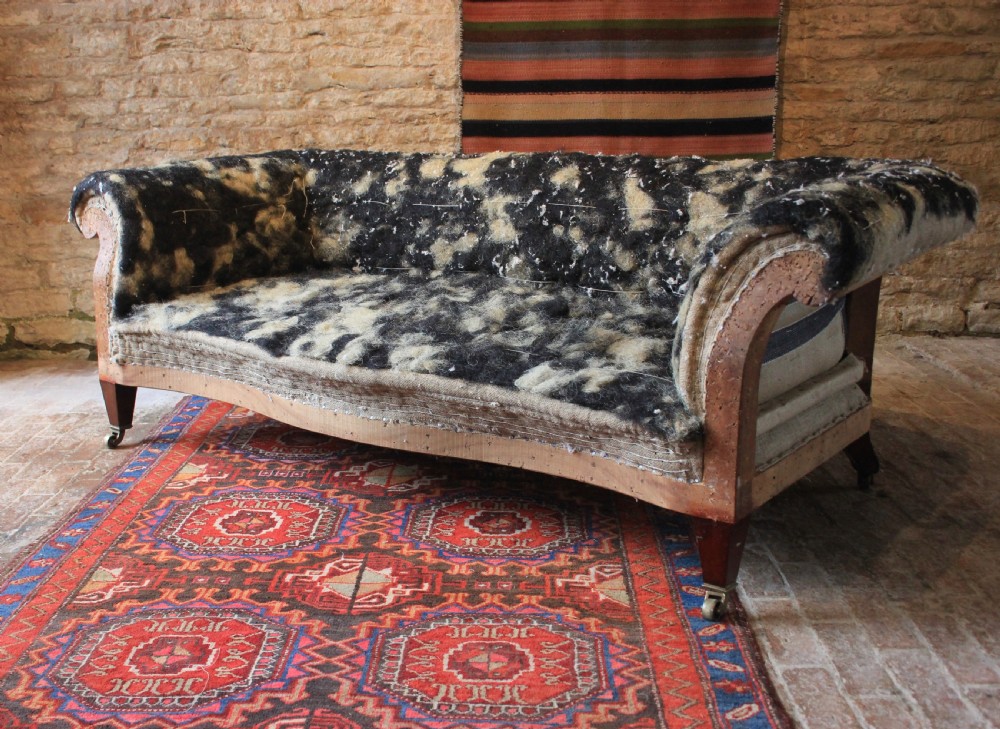 A Howard and sons serpentine front sofa 