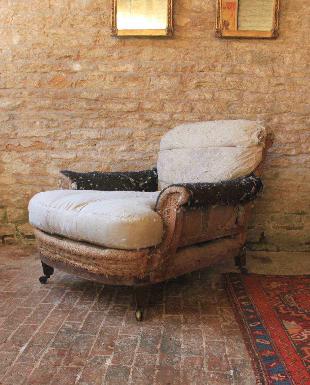 A large deep seated English armchair 