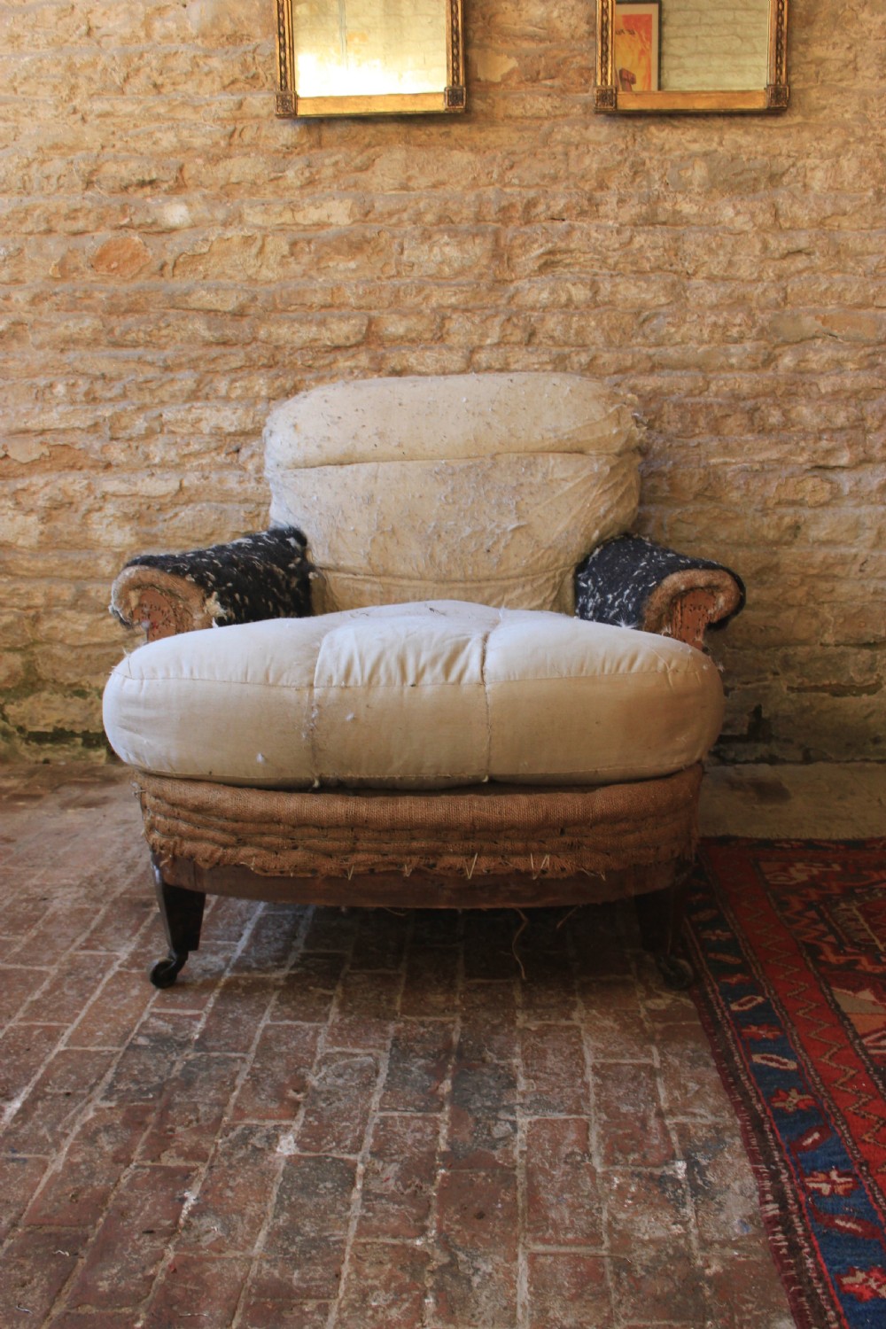 A large deep seated English armchair  View III