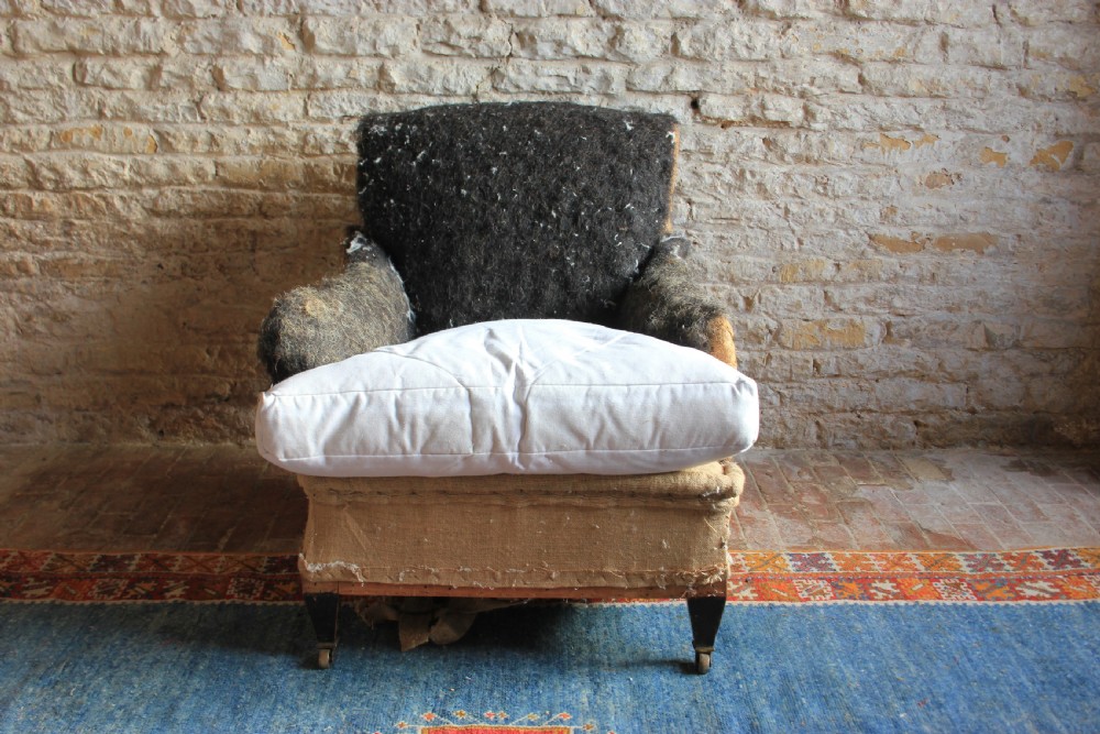 A large, deep seated Howard style armchair