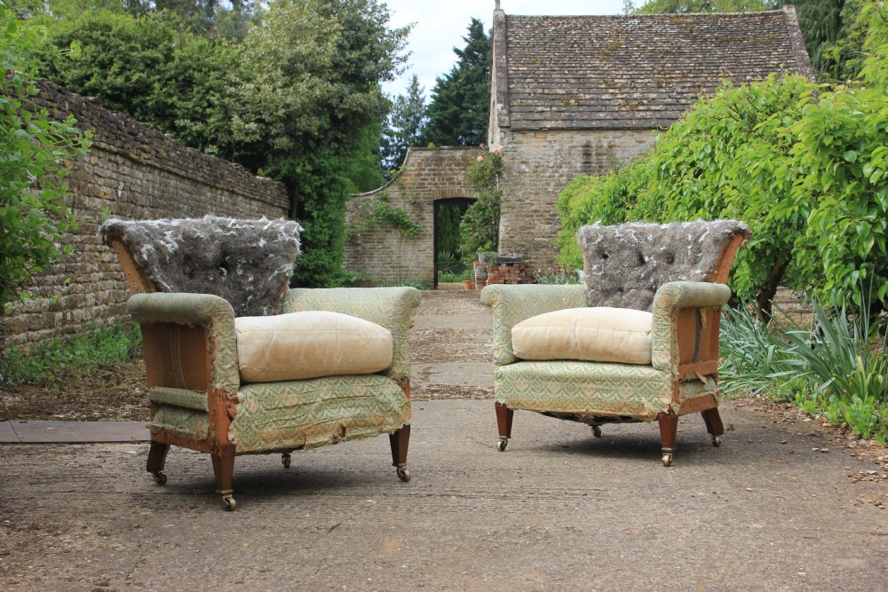 A pair of Howard & sons woodstock armchaira