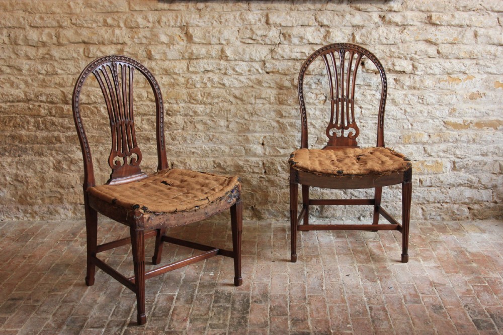 A pair of mahogany, Hepplewhite period hall chairs