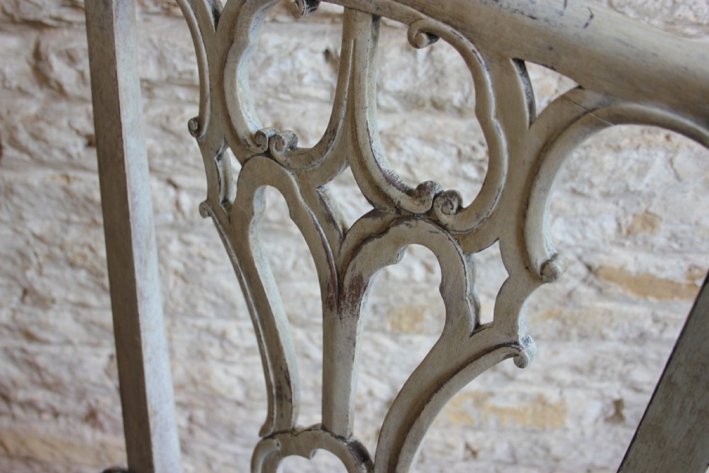A pair of 18th century painted hall chairs View II