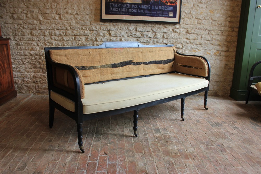 An Ebonised regency period Sofa