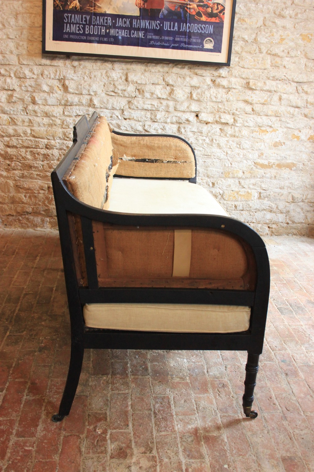 An Ebonised regency period Sofa View V