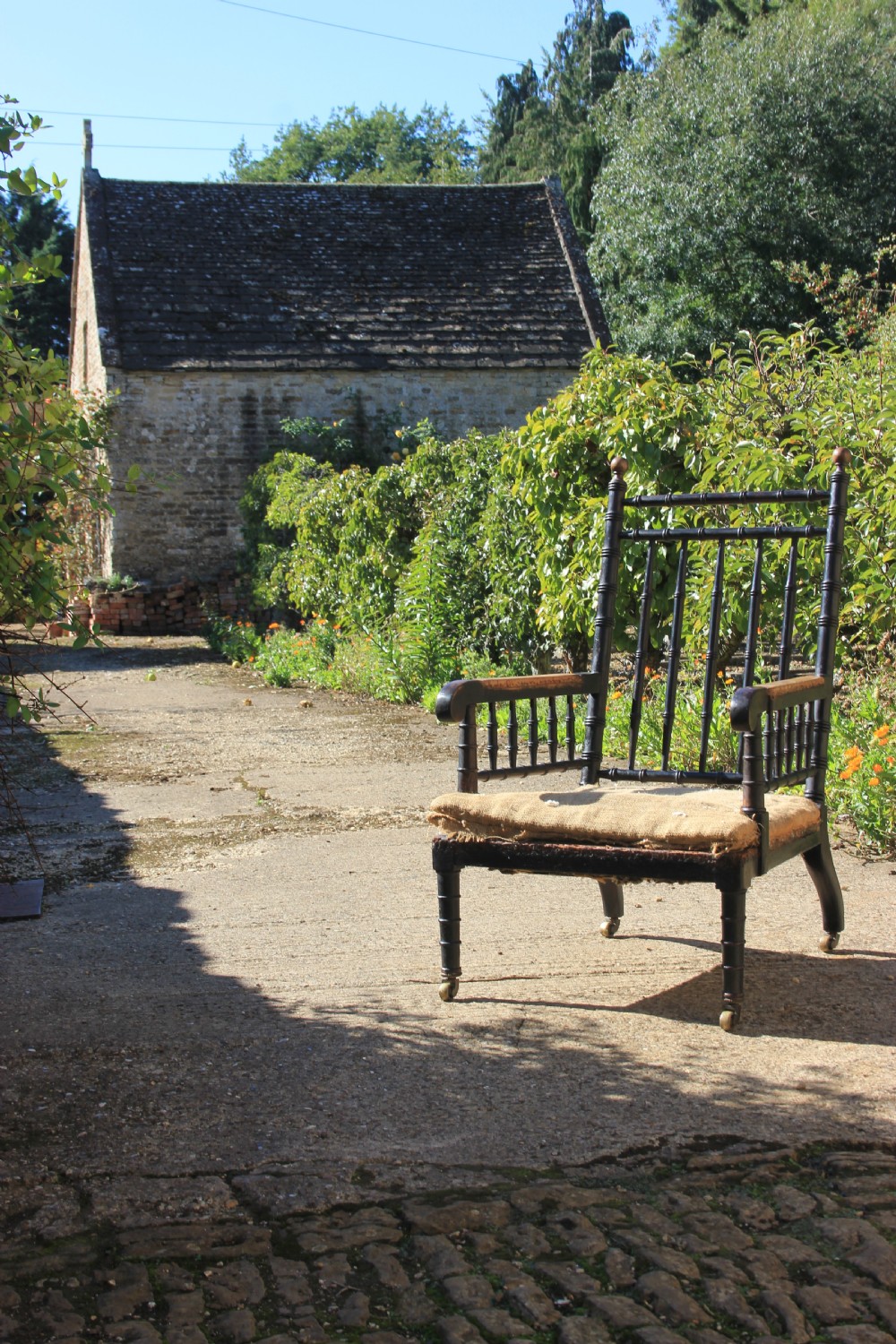 A 19th century Ebonised armchair 