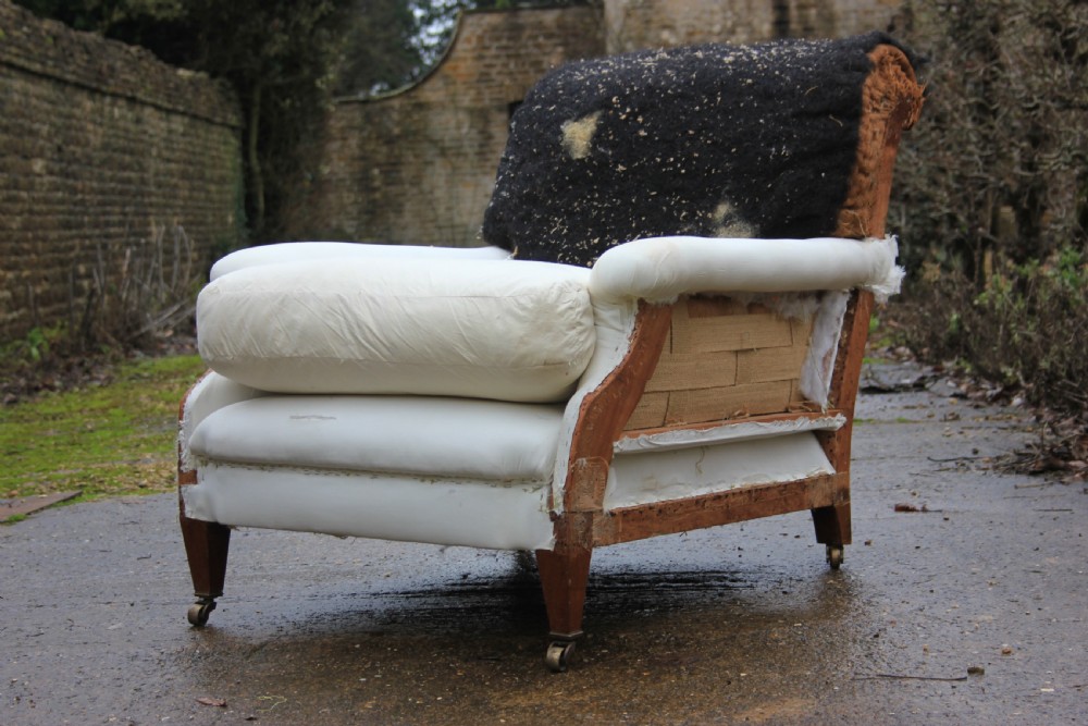 A deep seated flat-arm chair