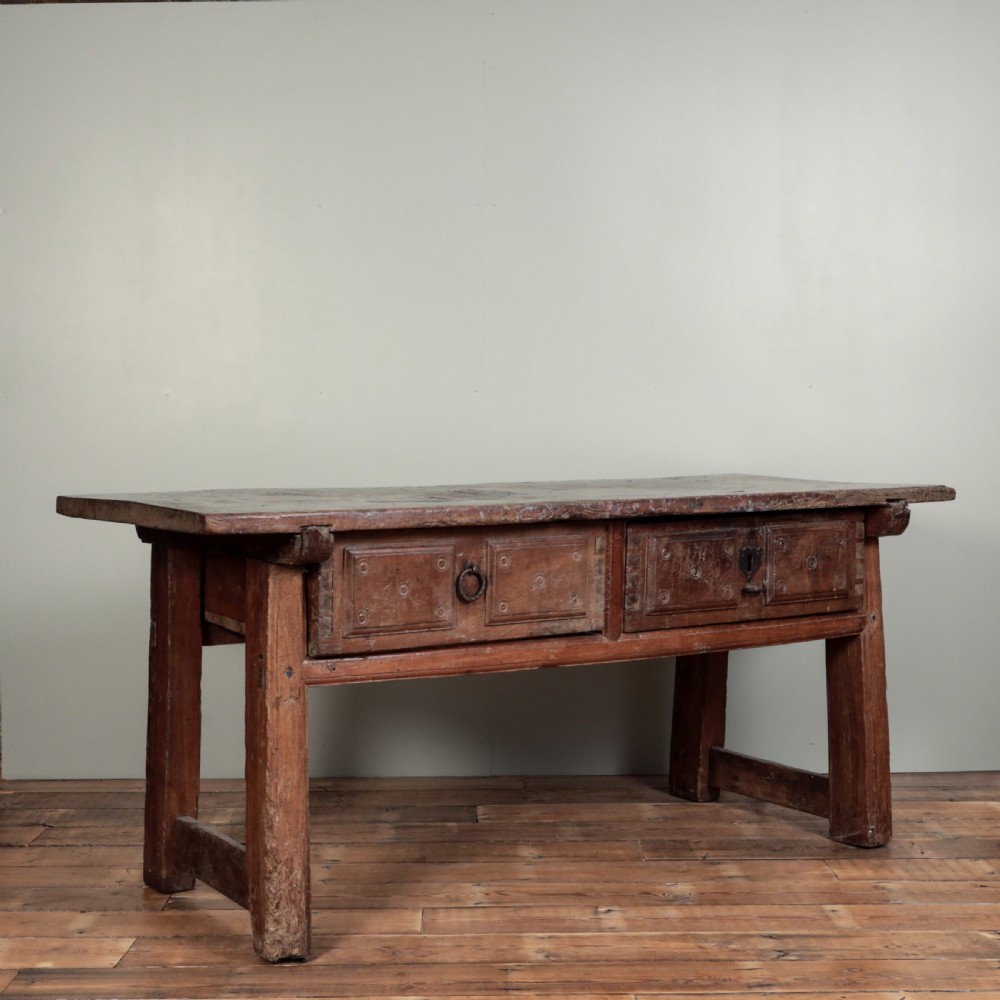 A 17th-century Spanish timber console table featuring two carved drawer fronts with iron ring handles. View II