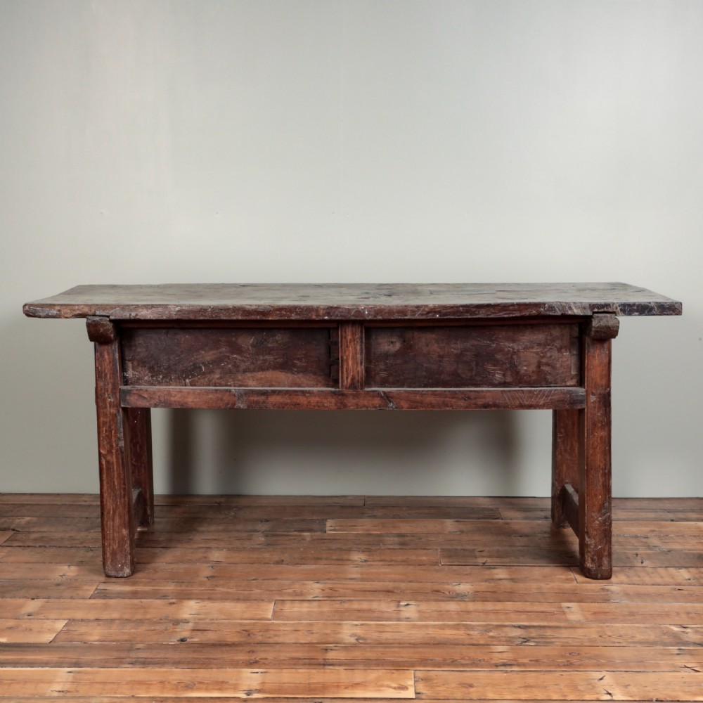 A 17th-century Spanish timber console table featuring two carved drawer fronts with iron ring handles. View III