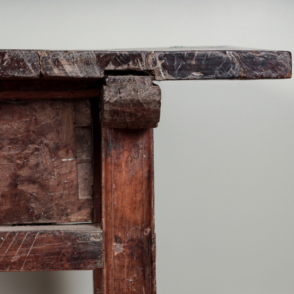 A 17th-century Spanish timber console table featuring two carved drawer fronts with iron ring handles. View VIII