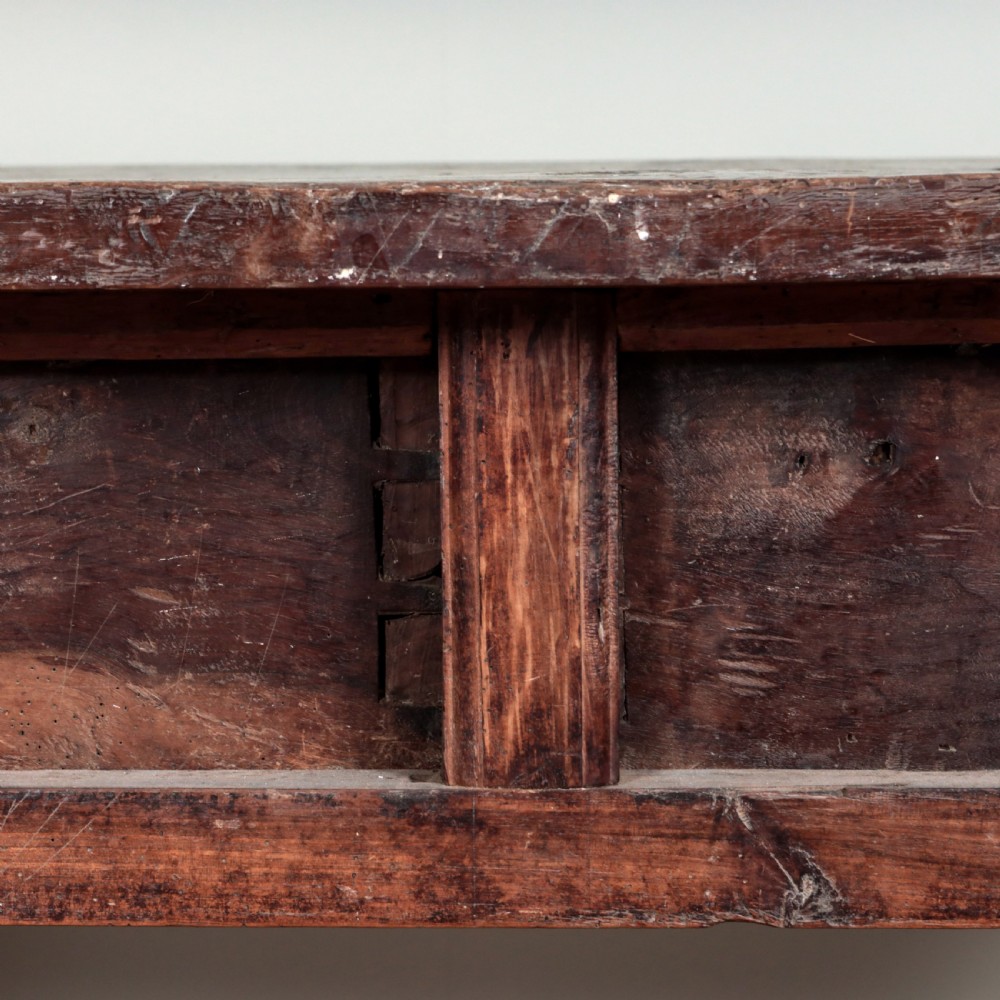 A 17th-century Spanish timber console table featuring two carved drawer fronts with iron ring handles. View IX