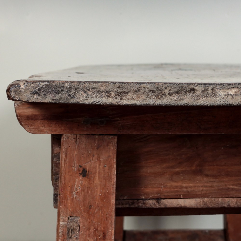 A 17th-century Spanish timber console table featuring two carved drawer fronts with iron ring handles. View XI