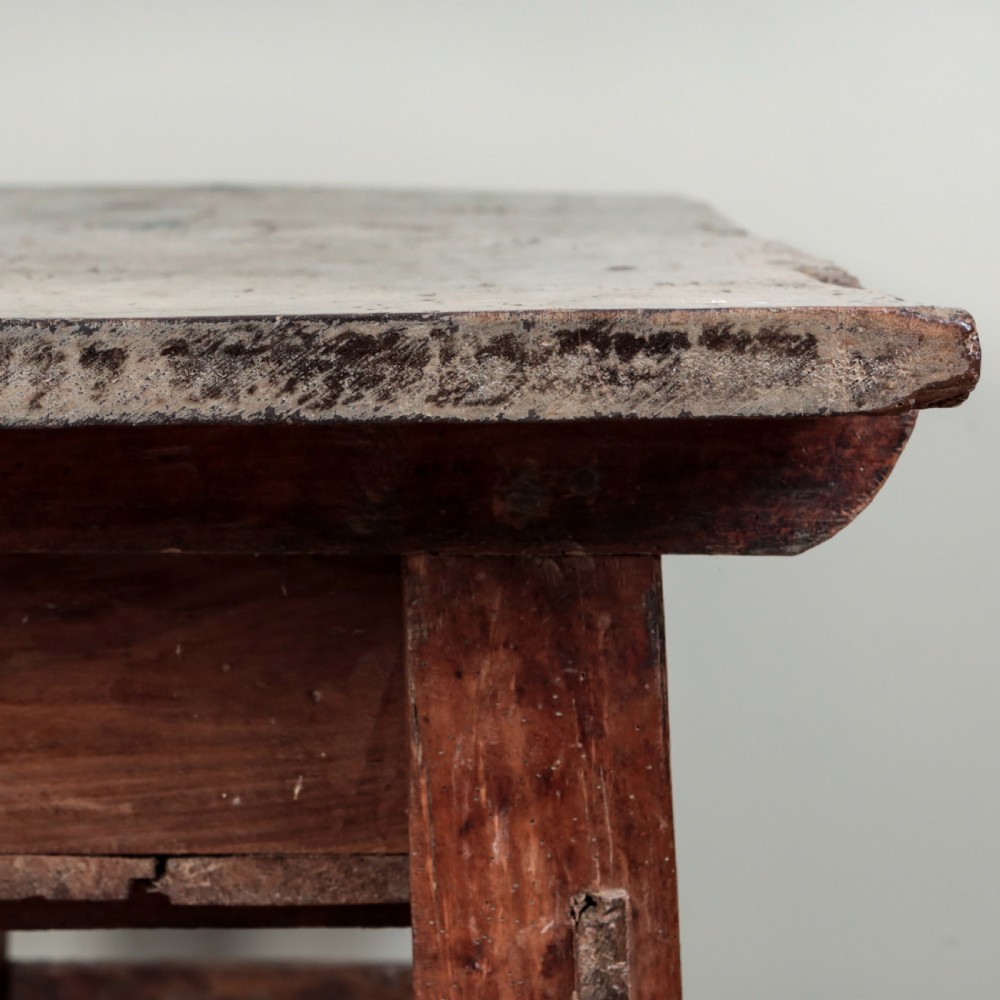 A 17th-century Spanish timber console table featuring two carved drawer fronts with iron ring handles. View XII