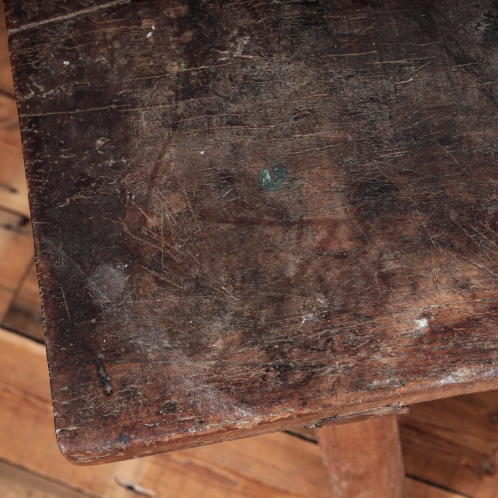 A 17th-century Spanish timber console table featuring two carved drawer fronts with iron ring handles. View XVI
