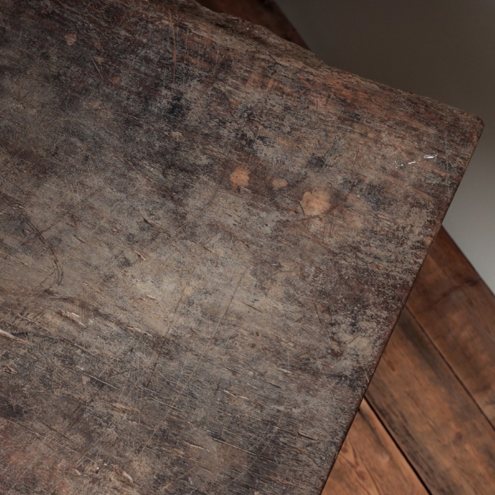 A 17th-century Spanish timber console table featuring two carved drawer fronts with iron ring handles. View XIX