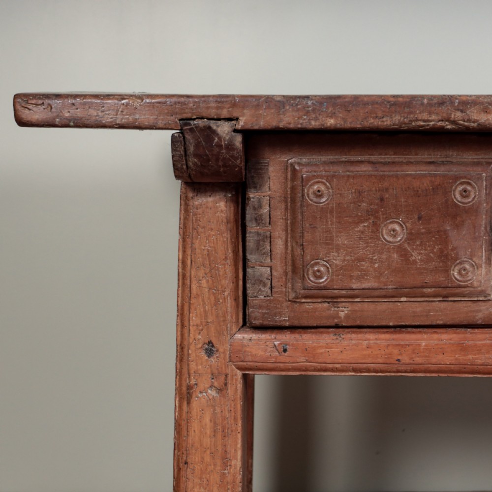 A 17th-century Spanish timber console table featuring two carved drawer fronts with iron ring handles. View XX