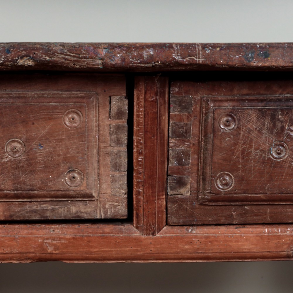 A 17th-century Spanish timber console table featuring two carved drawer fronts with iron ring handles. View XXII
