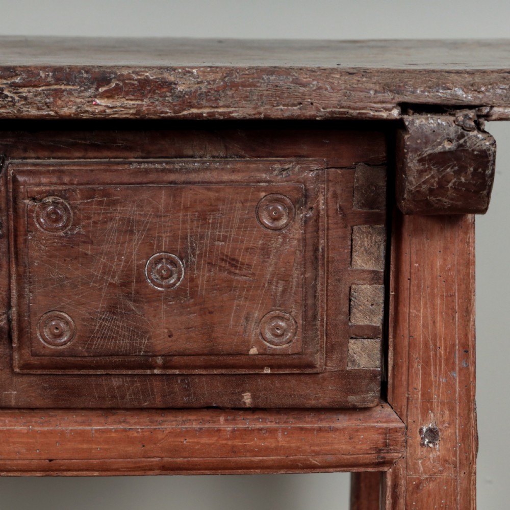 A 17th-century Spanish timber console table featuring two carved drawer fronts with iron ring handles. View XXIV