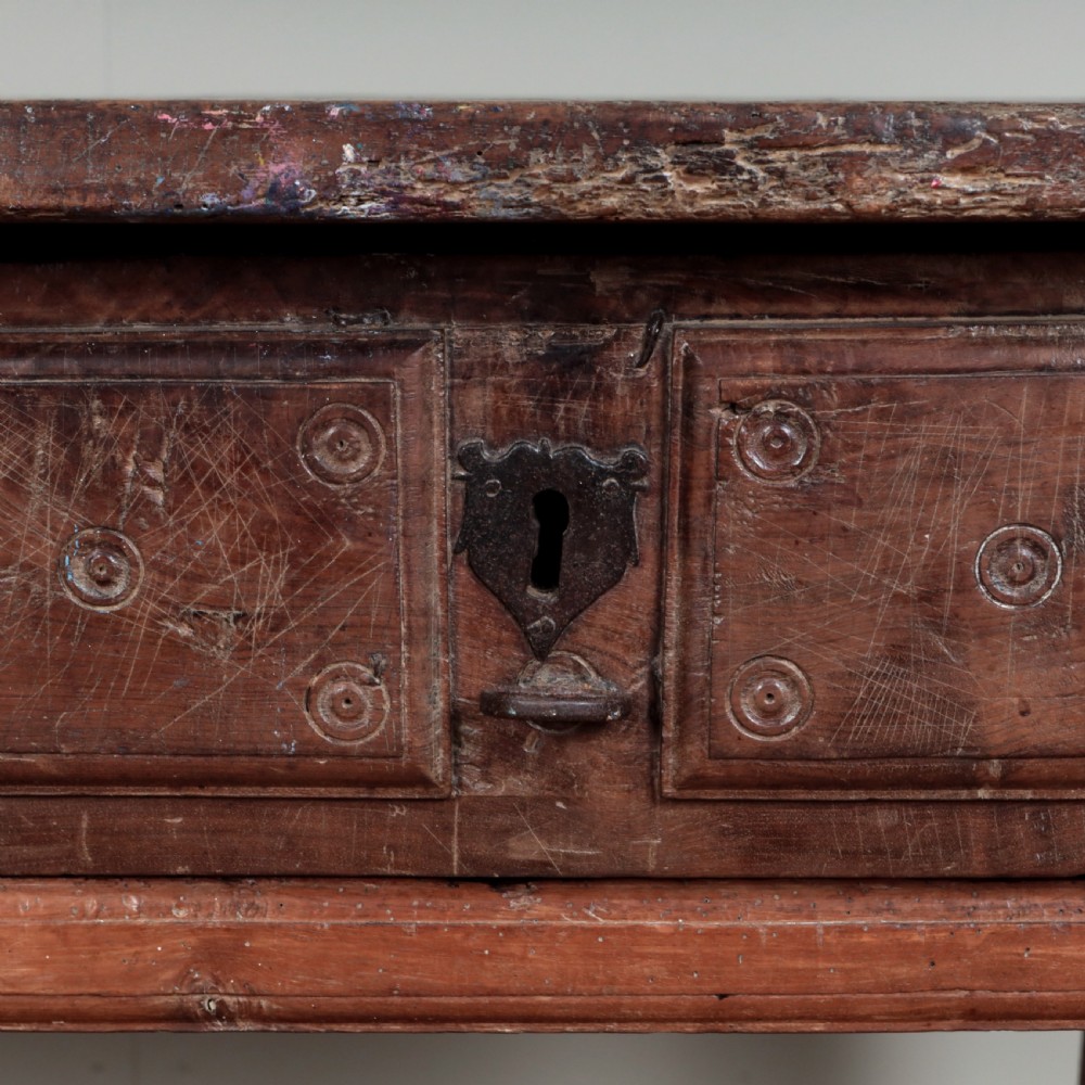 A 17th-century Spanish timber console table featuring two carved drawer fronts with iron ring handles. View XXV