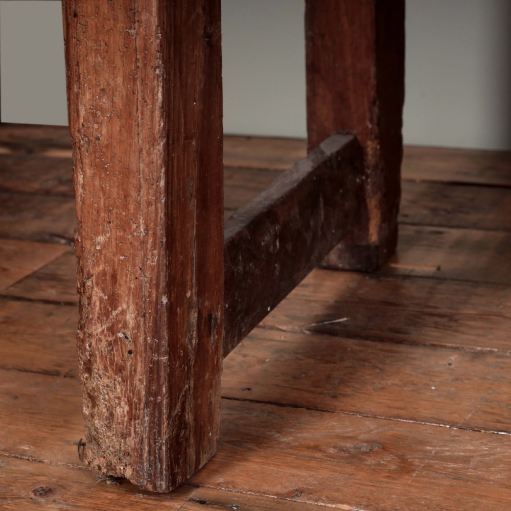 A 17th-century Spanish timber console table featuring two carved drawer fronts with iron ring handles. View XXVI