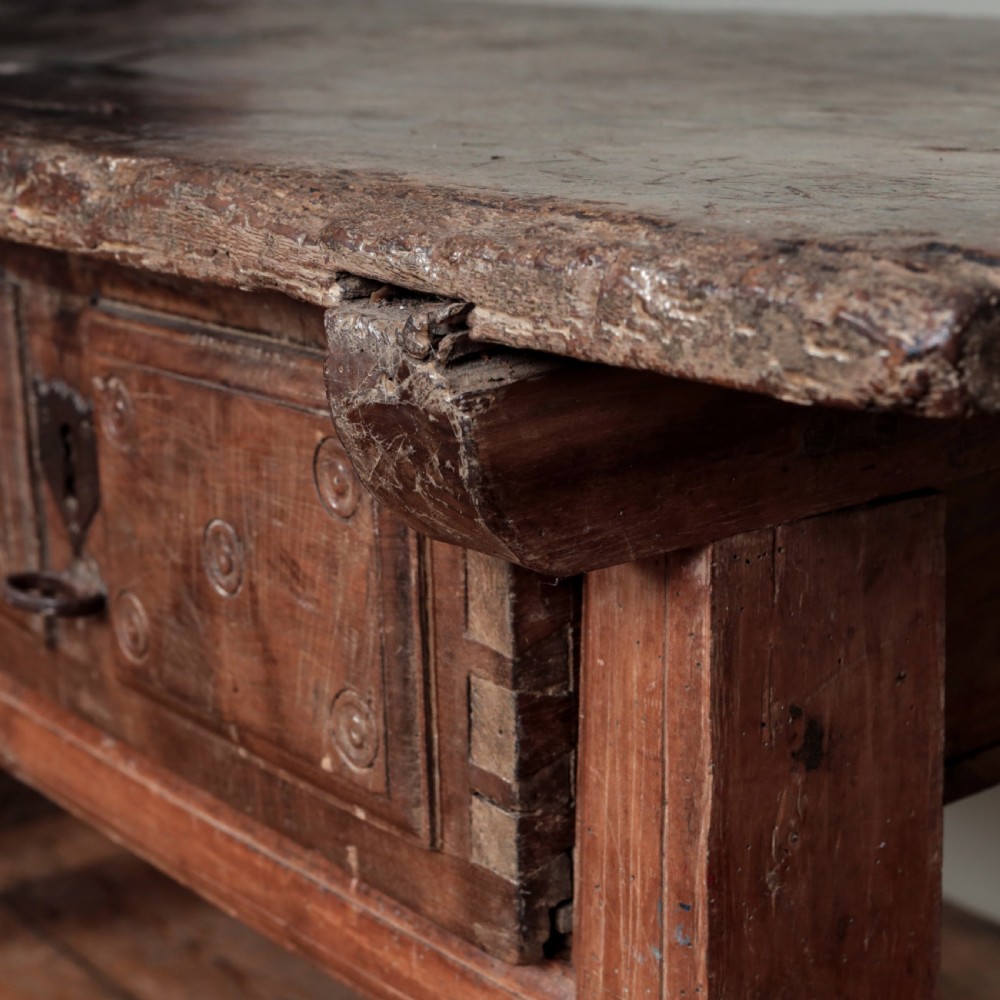 A 17th-century Spanish timber console table featuring two carved drawer fronts with iron ring handles. View XXIX