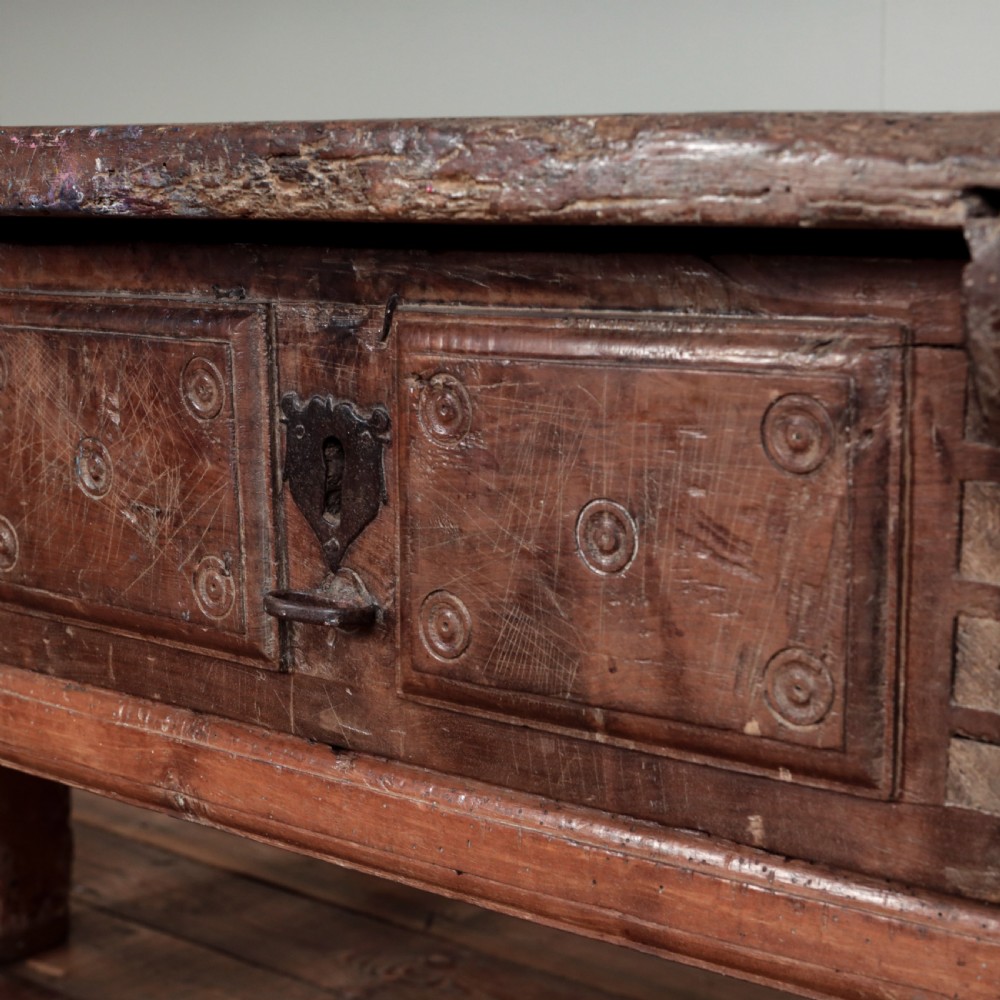 A 17th-century Spanish timber console table featuring two carved drawer fronts with iron ring handles. View XXX