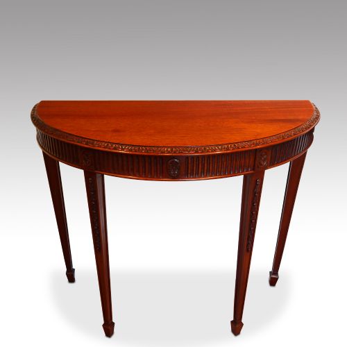 fig 2. Pair of Edwardian mahogany demi lune console tables