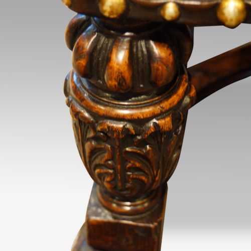 fig 1. Pair of carved oak and leather wing chairs