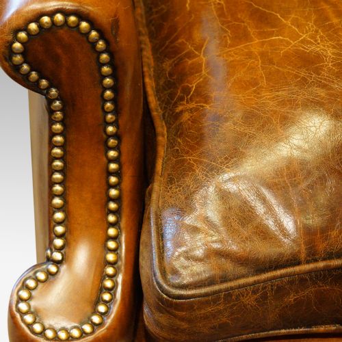 fig 2. Pair of carved oak and leather wing chairs