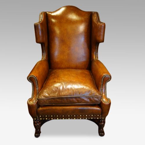 fig 3. Pair of carved oak and leather wing chairs