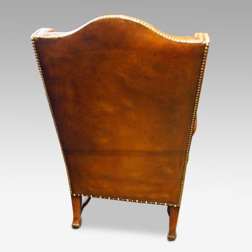 fig 6. Pair of carved oak and leather wing chairs