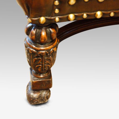 fig 10. Pair of carved oak and leather wing chairs