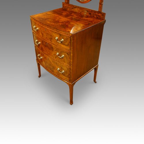 fig 1. Walnut bow front dressing chest