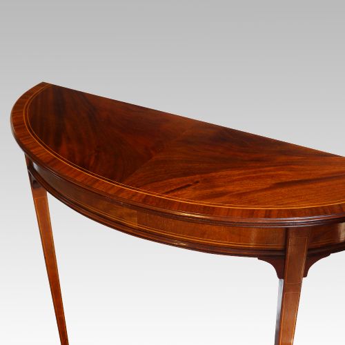 fig 1. Pair of Edwardian mahogany demi lune tables