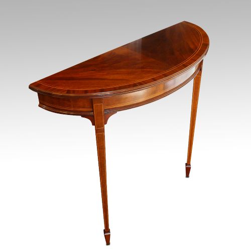 fig 2. Pair of Edwardian mahogany demi lune tables