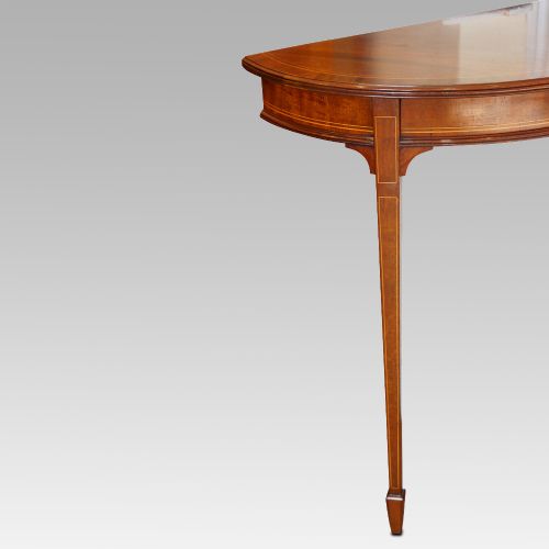 fig 5. Pair of Edwardian mahogany demi lune tables