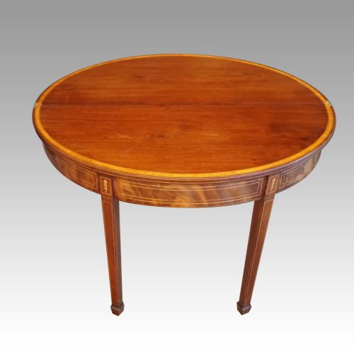 fig 2. Antique mahogany demi lune tea table