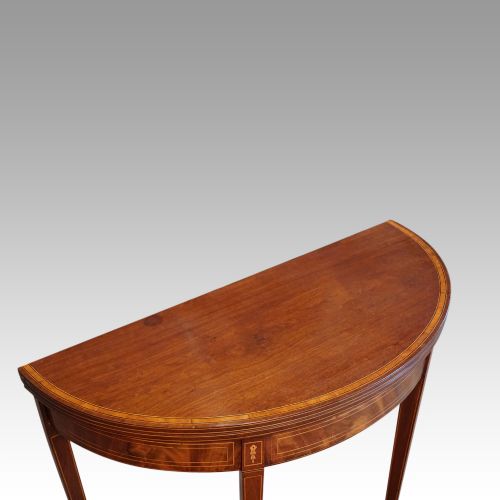 fig 4. Antique mahogany demi lune tea table