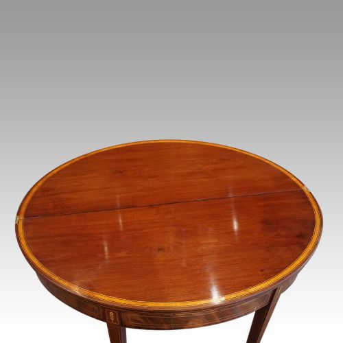 fig 6. Antique mahogany demi lune tea table
