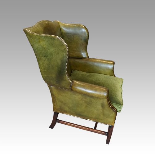 fig 1. Antique leather wing chair