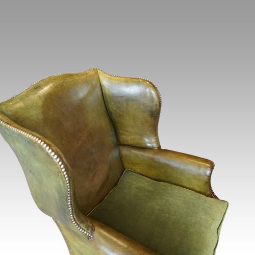 fig 4. Antique leather wing chair