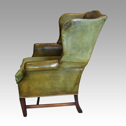 fig 7. Antique leather wing chair