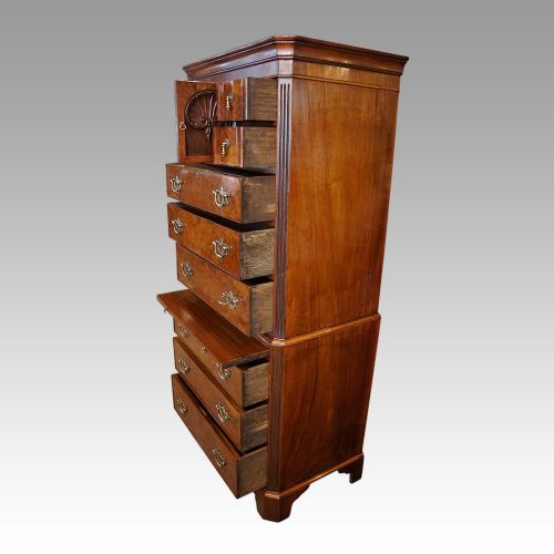 fig 6. George V Walnut chest on chest