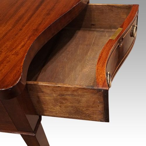 fig 4. George VI serpentine mahogany serving table