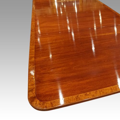 fig 4. George V mahogany triple pillar dining table