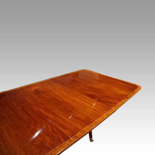 fig 6. George V mahogany triple pillar dining table