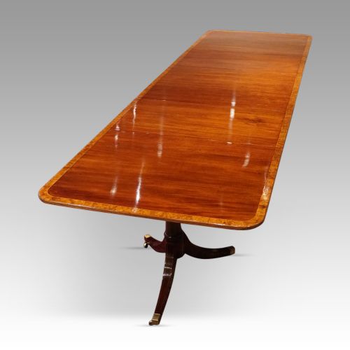 fig 7. George V mahogany triple pillar dining table