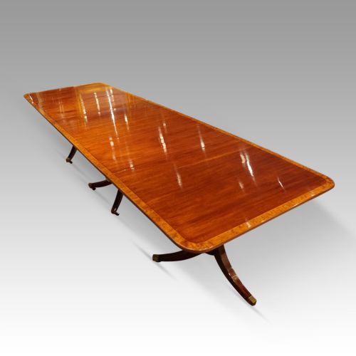 fig 8. George V mahogany triple pillar dining table