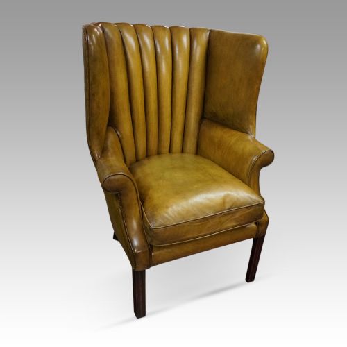 fig 4. Antique leather wing chair